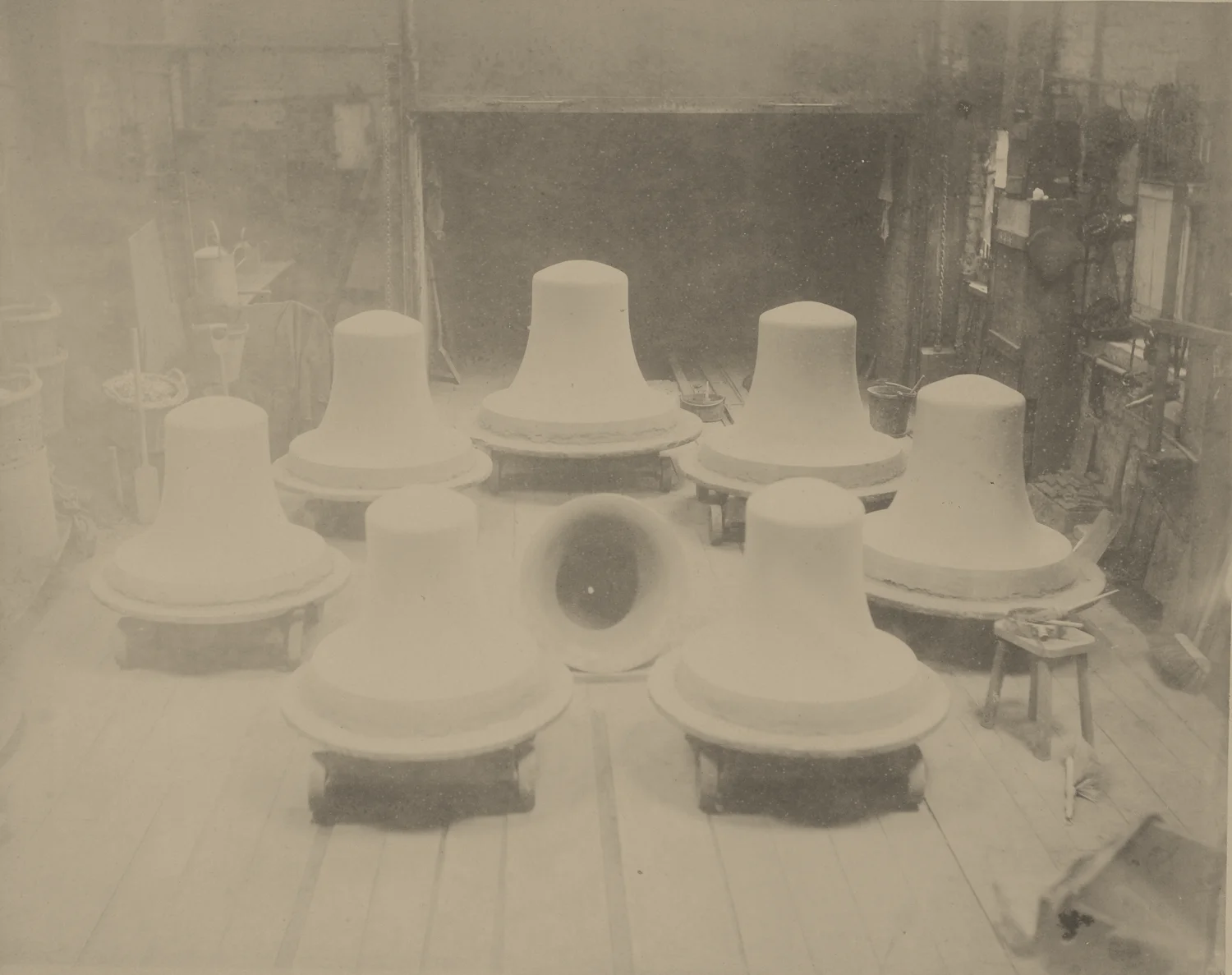 Historic bell moulds on a workshop floor